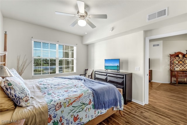 bedroom with hardwood / wood-style flooring and ceiling fan