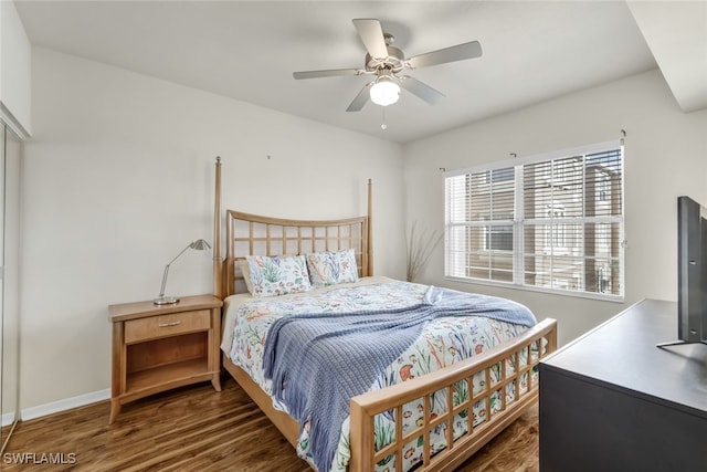 bedroom featuring ceiling fan and dark hardwood / wood-style flooring