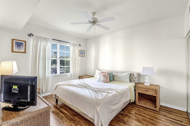 bedroom featuring wood-type flooring and ceiling fan