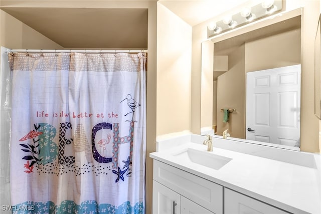 bathroom featuring vanity and walk in shower