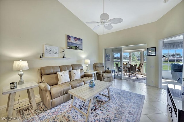 tiled living room with high vaulted ceiling and ceiling fan