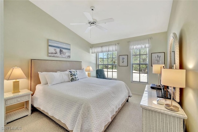 carpeted bedroom featuring ceiling fan and vaulted ceiling