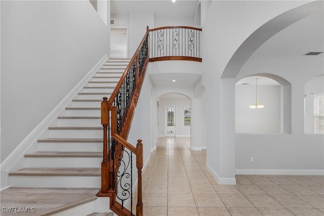 stairs featuring tile patterned flooring