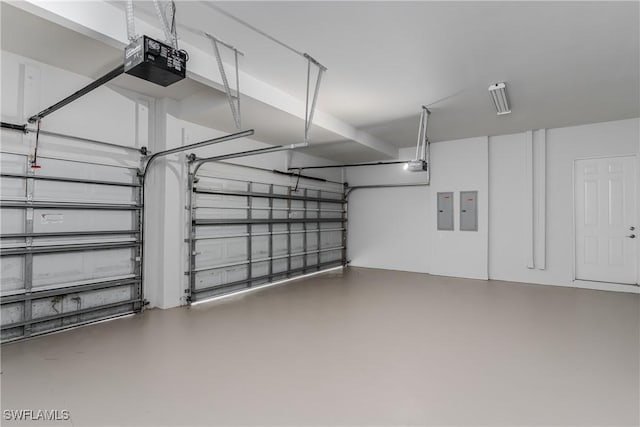 garage featuring a garage door opener and electric panel