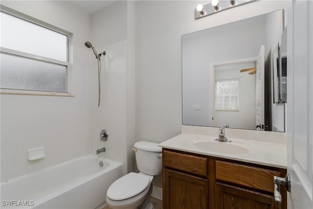 full bathroom with shower / tub combination, vanity, toilet, and a wealth of natural light