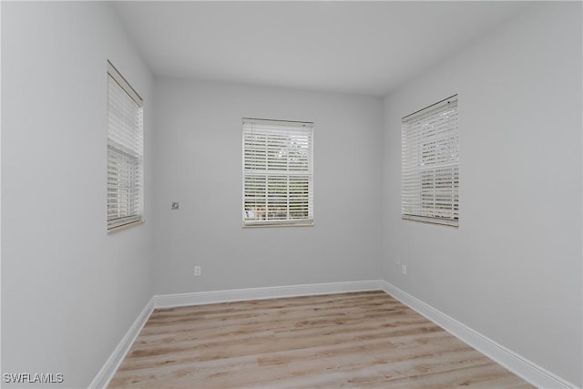 unfurnished room featuring light hardwood / wood-style flooring