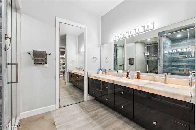 bathroom featuring vanity and an enclosed shower