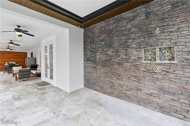 view of patio / terrace with french doors, ceiling fan, and an outdoor living space