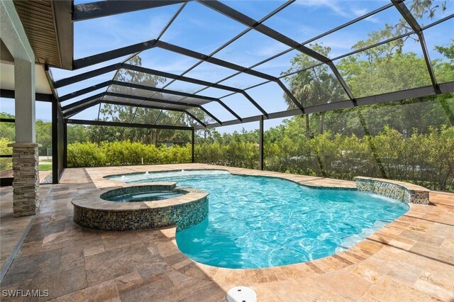 850 25th St SW, Naples, FL 34117 - view of swimming pool featuring a pool with connected hot tub, a patio, and glass enclosure