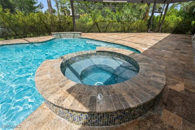 850 25th St SW, Naples, FL 34117 - view of swimming pool with a pool with connected hot tub