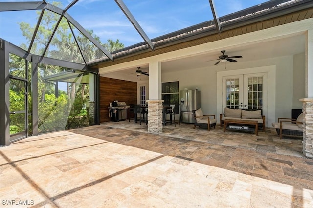 850 25th St SW, Naples, FL 34117 - view of patio / terrace with french doors, ceiling fan, a grill, and a lanai