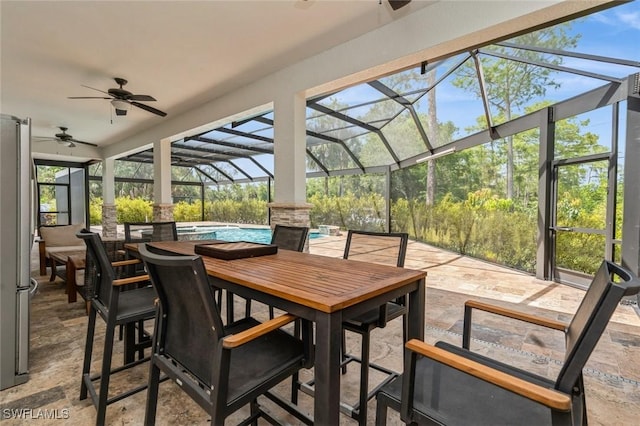 850 25th St SW, Naples, FL 34117 - view of patio / terrace with a ceiling fan, an outdoor pool, outdoor dining area, and a lanai