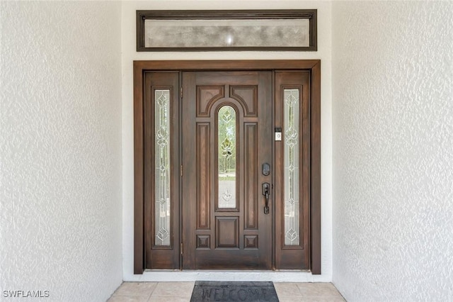 850 25th St SW, Naples, FL 34117 - property entrance with stucco siding