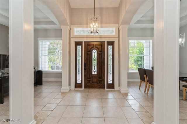 850 25th St SW, Naples, FL 34117 - foyer entrance with ornate columns, healthy amount of natural light, baseboards, and ornamental molding