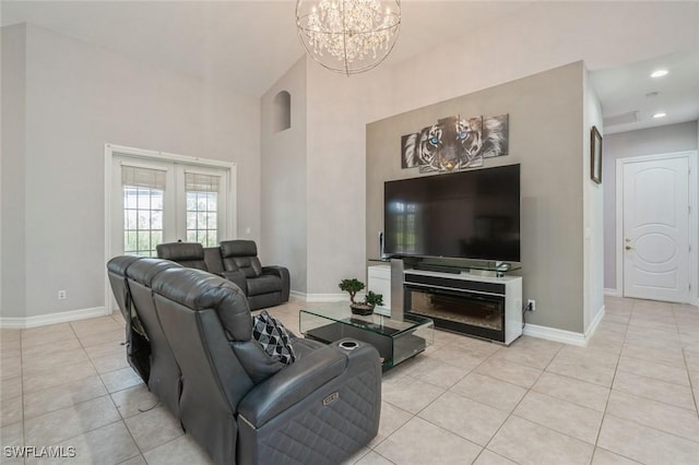 850 25th St SW, Naples, FL 34117 - living area featuring light tile patterned floors, baseboards, a high ceiling, a chandelier, and recessed lighting
