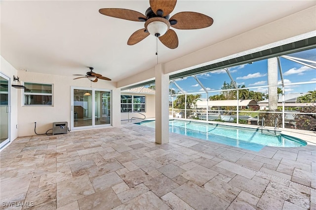 view of pool with a patio, a lanai, and ceiling fan