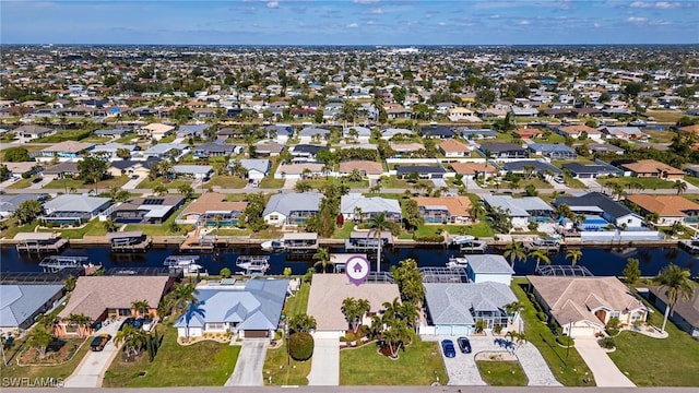 drone / aerial view featuring a water view