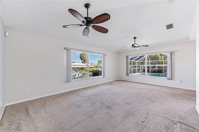 unfurnished living room with ceiling fan and carpet flooring