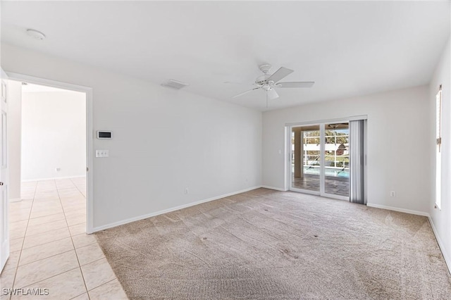 unfurnished room with light tile patterned flooring and ceiling fan