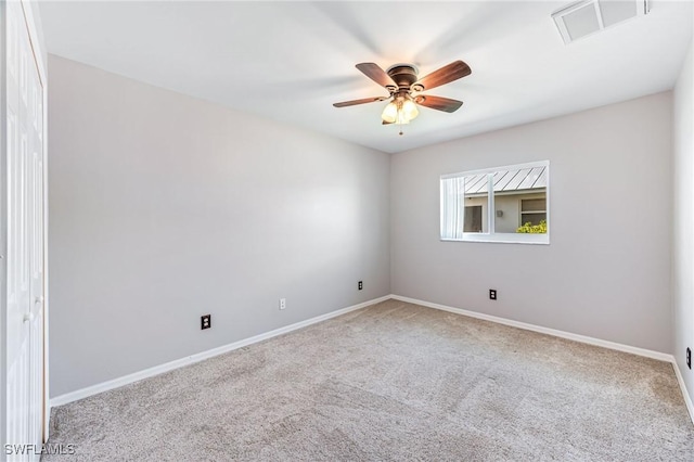 carpeted empty room with ceiling fan