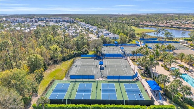 birds eye view of property with a water view