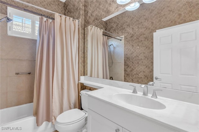 full bathroom featuring vanity, shower / bathtub combination with curtain, and toilet