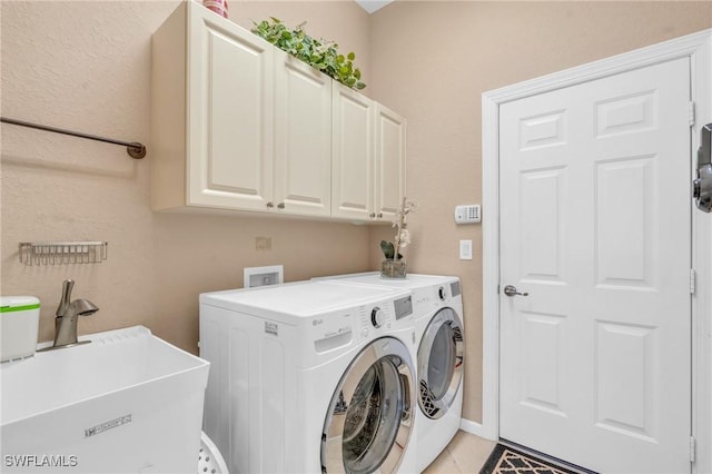 12890 Kentfield Ln, Fort Myers, FL 33913 - clothes washing area with separate washer and dryer, a sink, light tile patterned floors, and cabinet space