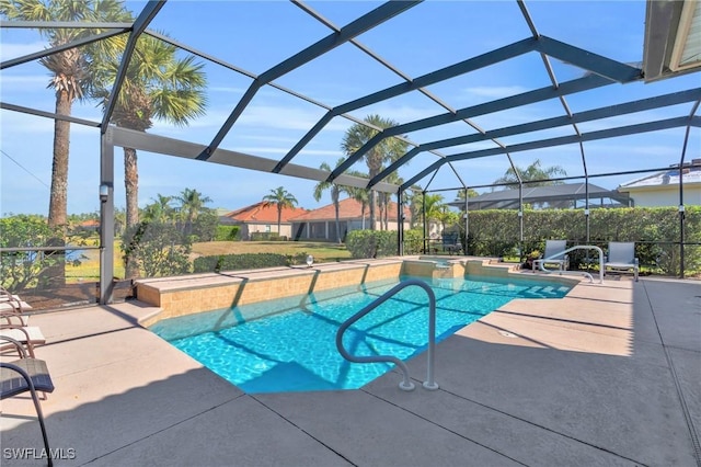 view of swimming pool with an in ground hot tub, a patio, and glass enclosure