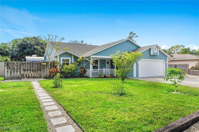 view of front of house with a garage, a front yard, and a porch