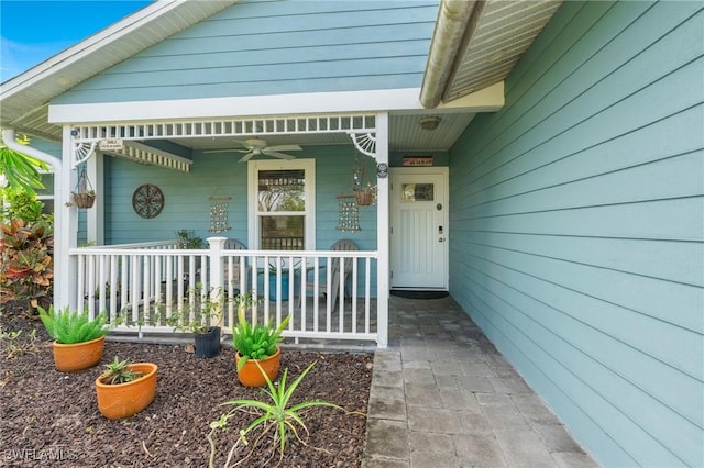 doorway to property with ceiling fan and covered porch