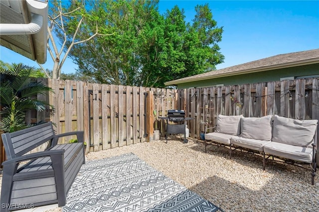 view of patio / terrace with an outdoor living space and grilling area