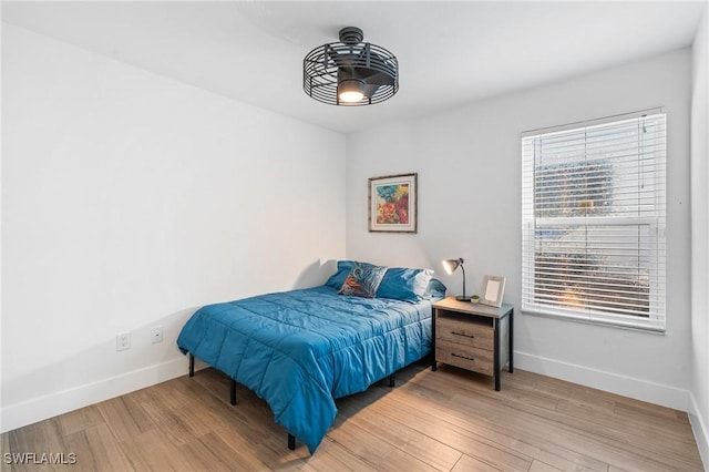 bedroom with hardwood / wood-style floors