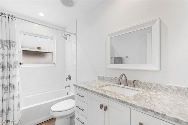 full bathroom with vanity, toilet, and shower / bath combo with shower curtain