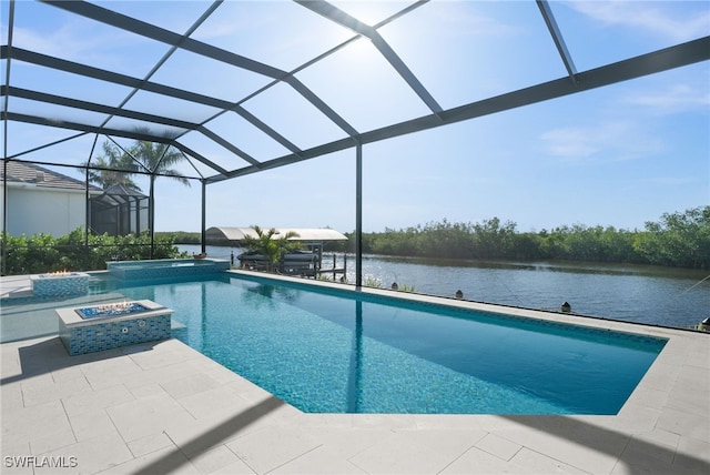 view of swimming pool featuring an in ground hot tub, a water view, glass enclosure, and a patio area