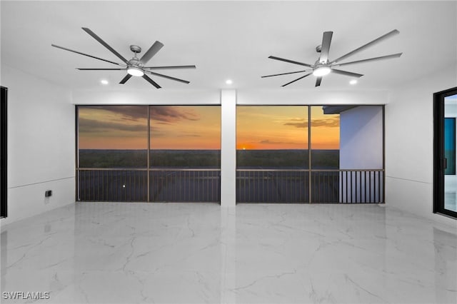 spare room with ceiling fan