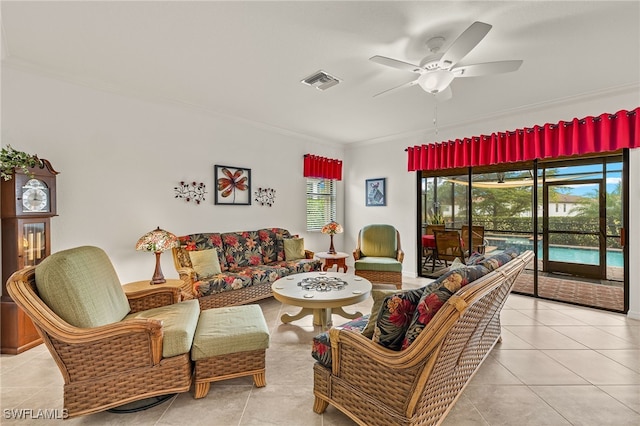 tiled living room featuring ornamental molding and ceiling fan