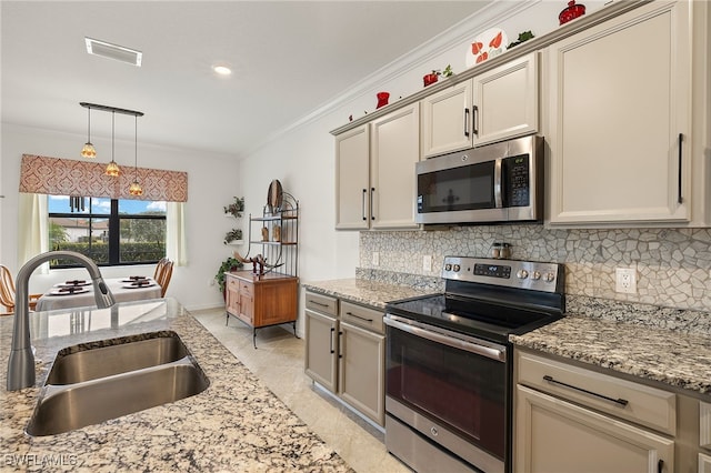 kitchen with ornamental molding, appliances with stainless steel finishes, sink, and backsplash