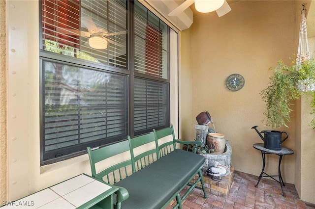 view of patio featuring ceiling fan