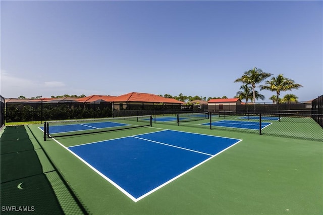 view of sport court with basketball hoop