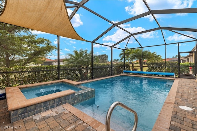 view of swimming pool with an in ground hot tub, a lanai, and a patio