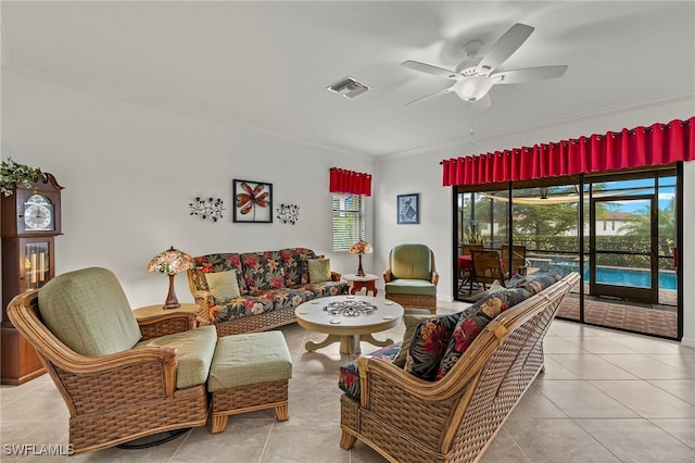 tiled living room with crown molding and ceiling fan