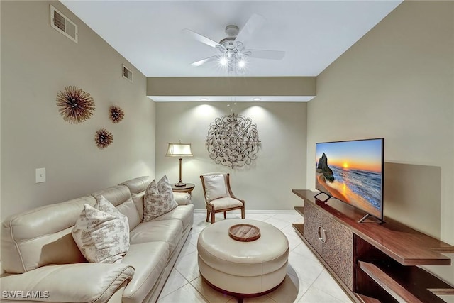 tiled living room with ceiling fan