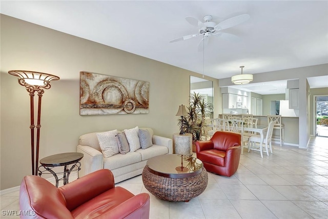 tiled living room with ceiling fan