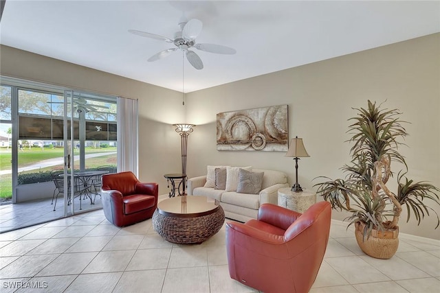 tiled living room with ceiling fan