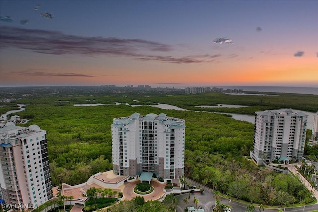 aerial view at dusk with a water view