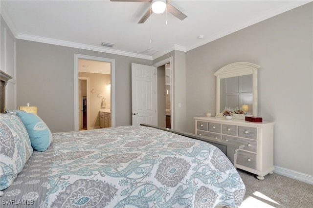 carpeted bedroom with ornamental molding, connected bathroom, and ceiling fan