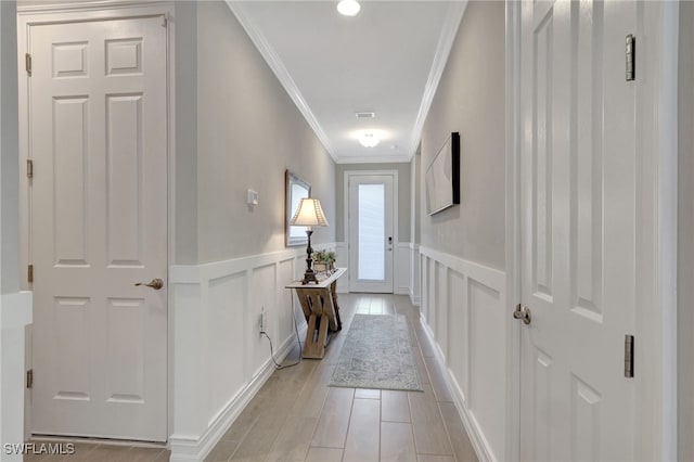 corridor featuring ornamental molding