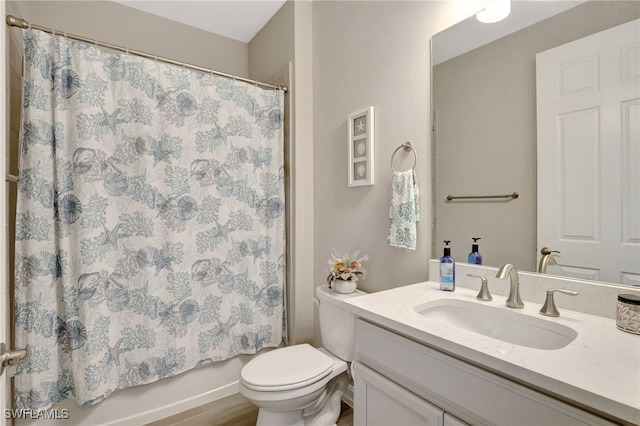 full bathroom with vanity, wood-type flooring, shower / bath combo with shower curtain, and toilet