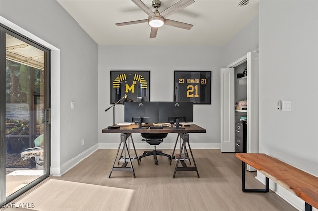 office with hardwood / wood-style flooring and ceiling fan