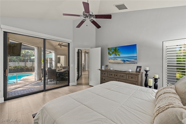 bedroom featuring lofted ceiling, access to exterior, light hardwood / wood-style floors, and ceiling fan